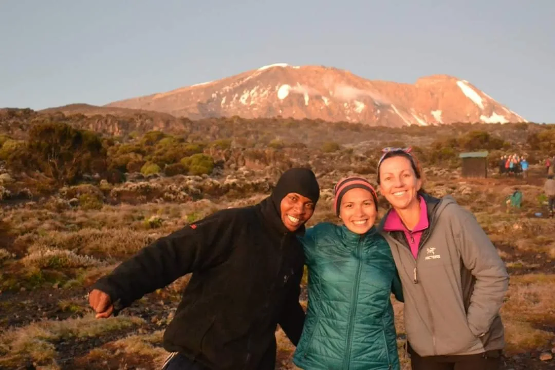 Climbing group photographed together at sunset on Kilimanjaro